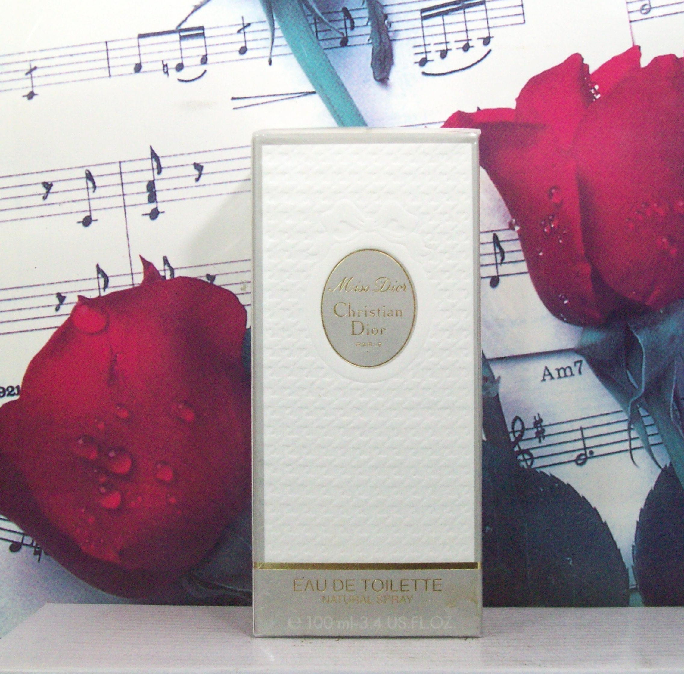 Christian Dior Miss Dior 3.4 OZ EDT Spray bottle front view, Miss Dior perfume luxury packaging by Dior, floral women fragrance elegant bottle, Dior Miss Dior eau de toilette spray close-up
